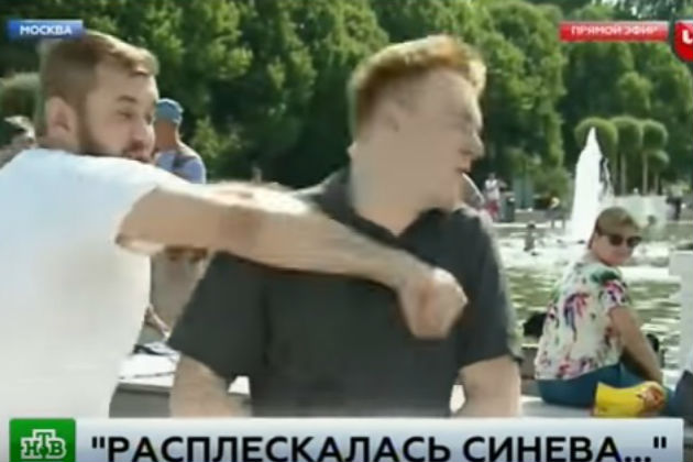 Watch This Russian TV Reporter Get Punched During a Live Shot