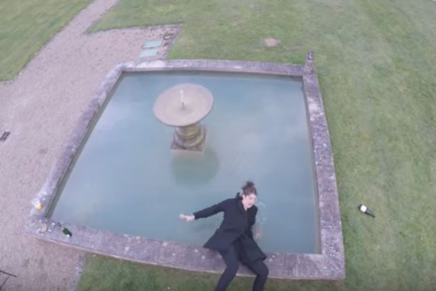 Watch This Woman Posing For a Drone Video Fall Into a Fountain