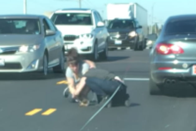 Watch These Two Women Pummel Each Other in the Middle of the Road [VIDEO]