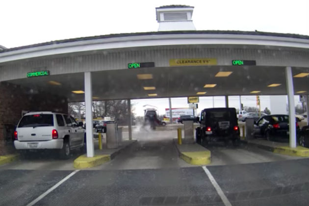 Watch This Car Unexpectedly Leave a Bank Drive-Thru and Go Flying [VIDEO]