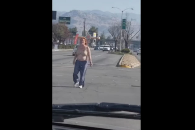 Watch This Woman Take Her Bra Off in the Middle of a Busy Intersection [NSFW VIDEO]