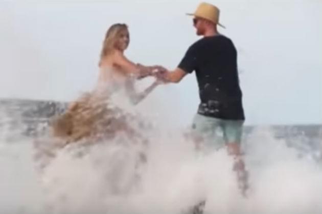 Watch Topless Kate Upton Get Swept Off a Rock By a Huge Wave [VIDEO]