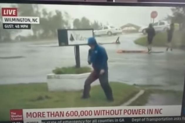 Watch This Weatherman Battle Hurricane Florence’s Winds While Two Dudes Casually Walk By [VIDEO]