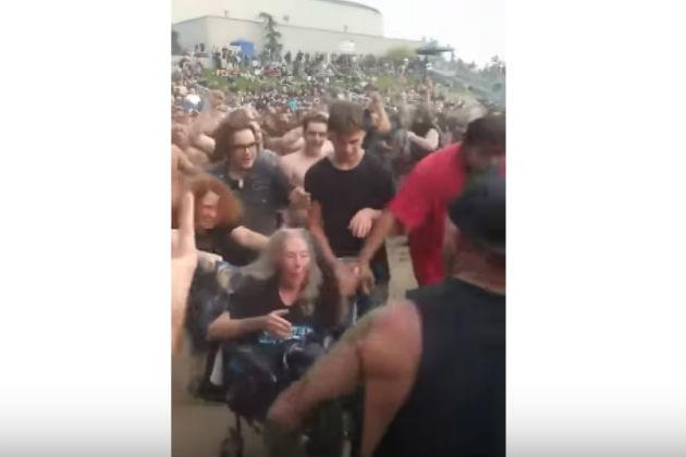 Watch This Woman Take Her Wheelchair Into a Mosh Pit [VIDEO]