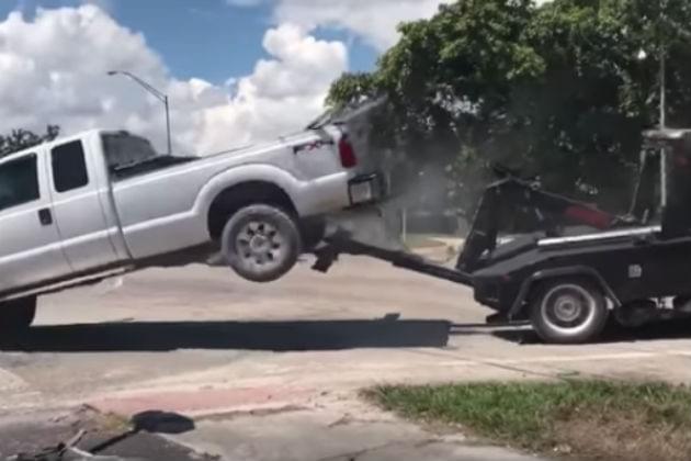 This Guy Tried to Drive His Truck Away As It Was Being Towed Away [VIDEO]