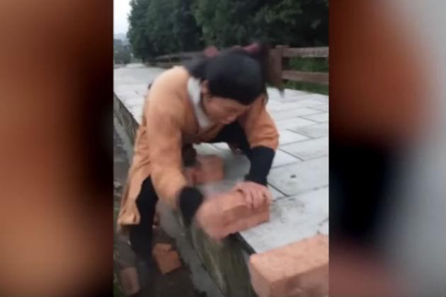 Watch This Guy Break 100 Bricks With His Bare Hands in Under 60 Seconds [VIDEO]