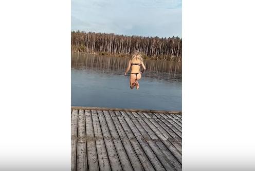 Watch This Thong-Wearing Woman Attempt to Do a Cannonball Into a Frozen Lake [VIDEO]