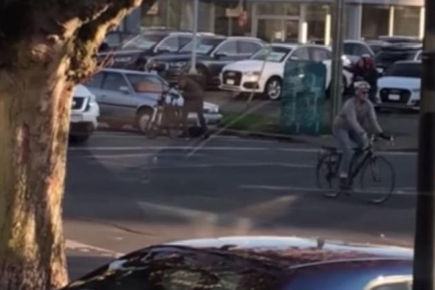 Watch This Cyclist Take a Dump In the Street and Throw It at a Car [VIDEO]