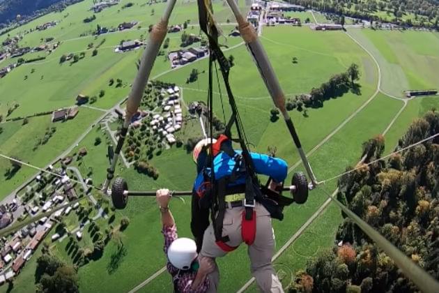 Watch This Swiss Hang Glider Hold On Tight After Realizing He’s Not Strapped In [VIDEO]