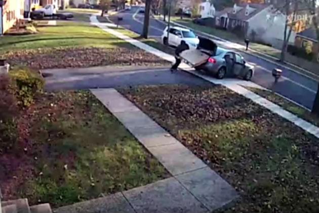 Watch This Package Thief Struggle to Get a Large TV in His Vehicle [VIDEO]