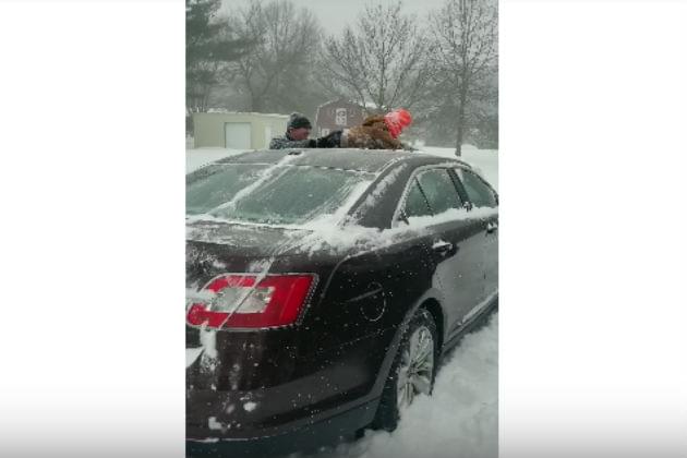 Watch This Dad Use His Son to Brush the Snow Off His Car [VIDEO]