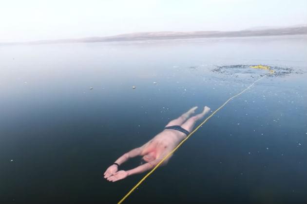 Watch This Freediver Swim Under the Icy Surface of a Lake [VIDEO]