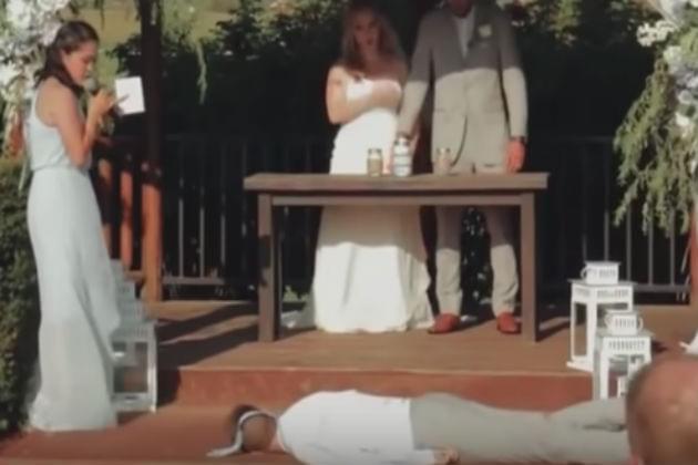 Watch This Best Man Faint In the Middle of a Bridesmaid’s Not-So-Great Singing Performance [VIDEO]