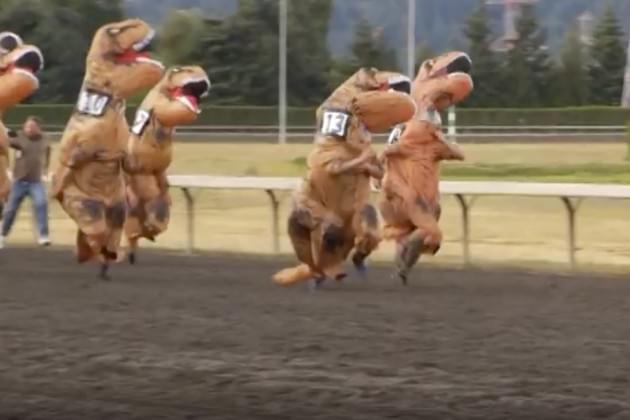 Watch These People Wearing T-Rex Costumes Race Towards the Finish Line [VIDEO]