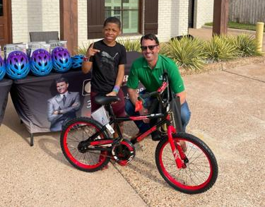 Gordon McKernan Gives Free Bikes to Shreveport Children