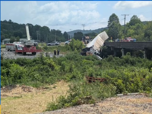 Tractor-Trailer Hangs from Bridge in Oliver Springs, Road Closed, Law Enforcement Says