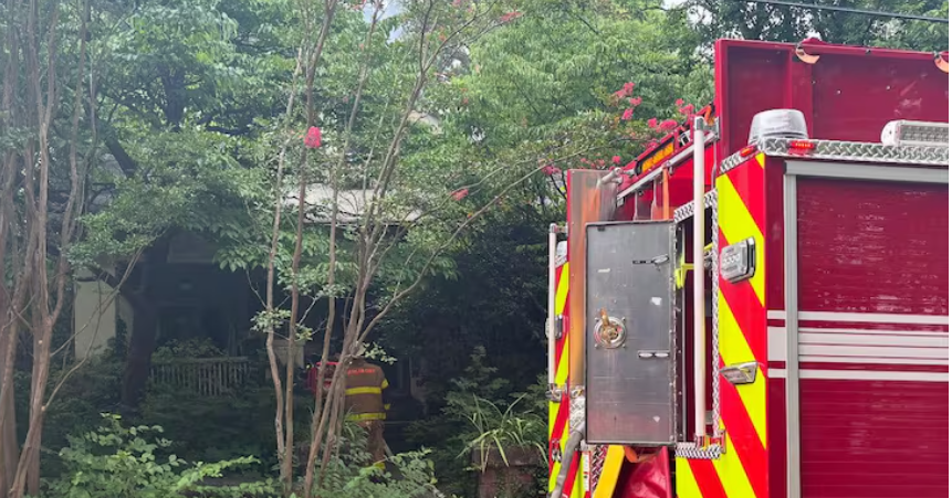 A Woman and Her Dog are Rescued from a Northeast House Fire Which is Under Investigation