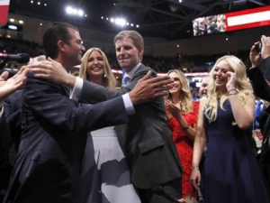 Republican Presidential Candidate Donald Trump's children Donald Trump, Jr., Ivanka Trump, Eric Trump and Tiffany Trump celebrate on the convention floor during the second day session of the Republican National Convention in Cleveland, Tuesday, July 19, 2016. (AP Photo/Carolyn Kaster)