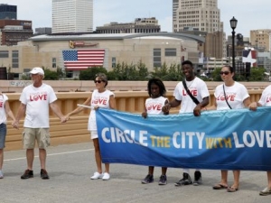 Circle the City With Love demonstrators walk across the Lorain-Carnegie bridge, Sunday, July 17, 2016, in Cleveland, ahead of the Republican National Convention that starts Monday. (AP Photo/Alex Brandon)