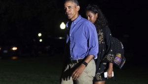 President Barack Obama, followed by daughter Sasha Obama, returns from a 16-day vacation to Martha's Vineyard, Mass., arriving at the White House in Washington, late Sunday, Aug. 21, 2016. (AP Photo/J. Scott Applewhite)