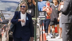 Democratic presidential candidate Hillary Clinton walks from her daughter Chelsea's apartment building Sunday, Sept. 11, 2016, in New York. (AP Photo/Craig Ruttle)