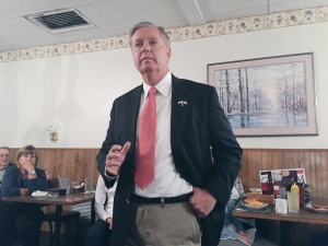 Republican presidential candidate Lindsey Graham takes questions at a cafe in Indianola. (photo by Sarah Beckman)