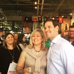 Republican presidential candidate Marco Rubio poses with a voter at Firetrucker Brewery in Ankeny. (photo by Sarah Beckman)