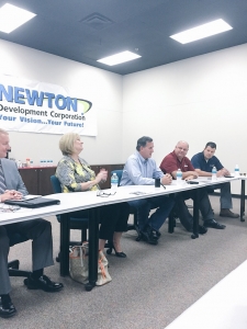 Republican presidential candidate (third from right) meets with business owners in Newton. (photo by Sarah Beckman)