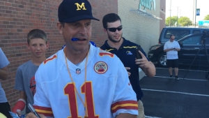 Harbaugh putting on satellite camp fashion show