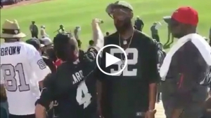 Raiders fans fight in stands during game vs. Falcons
