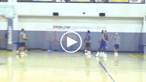 Klay Thompson throws football around between taking jump shots