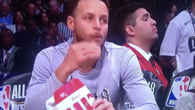 Curry eats popcorn on bench during All-Star Game