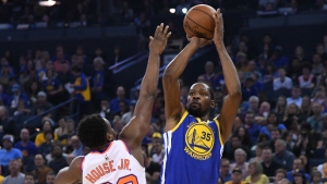 Warriors overcome slow start to beat visiting Suns