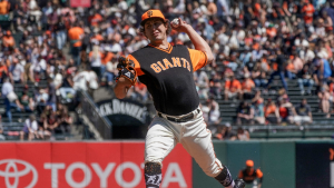 Pair of triples, dominant Holland start lead Giants to win over Rangers