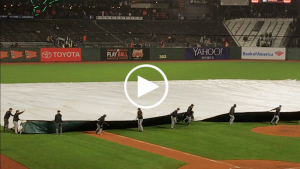Giants groundskeeper falls, dragged by tarp while covering the field