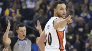 Steph Curry congratulates Tiger Woods after winning Masters