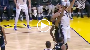 Warriors’ Jacob Evans helped off court after elbow to face
