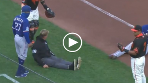 Giants catcher accidentally trucks ump during rundown