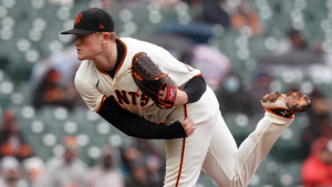 Logan Webb dominates with his arm and bat in eventful and rainy Giants win