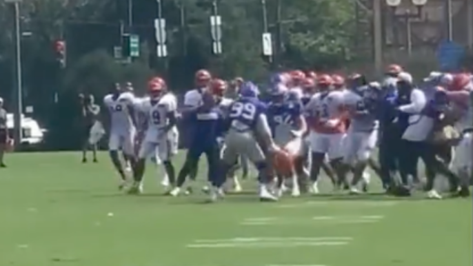 Aaron Donald swings two helmets at Bengals players during practice fight