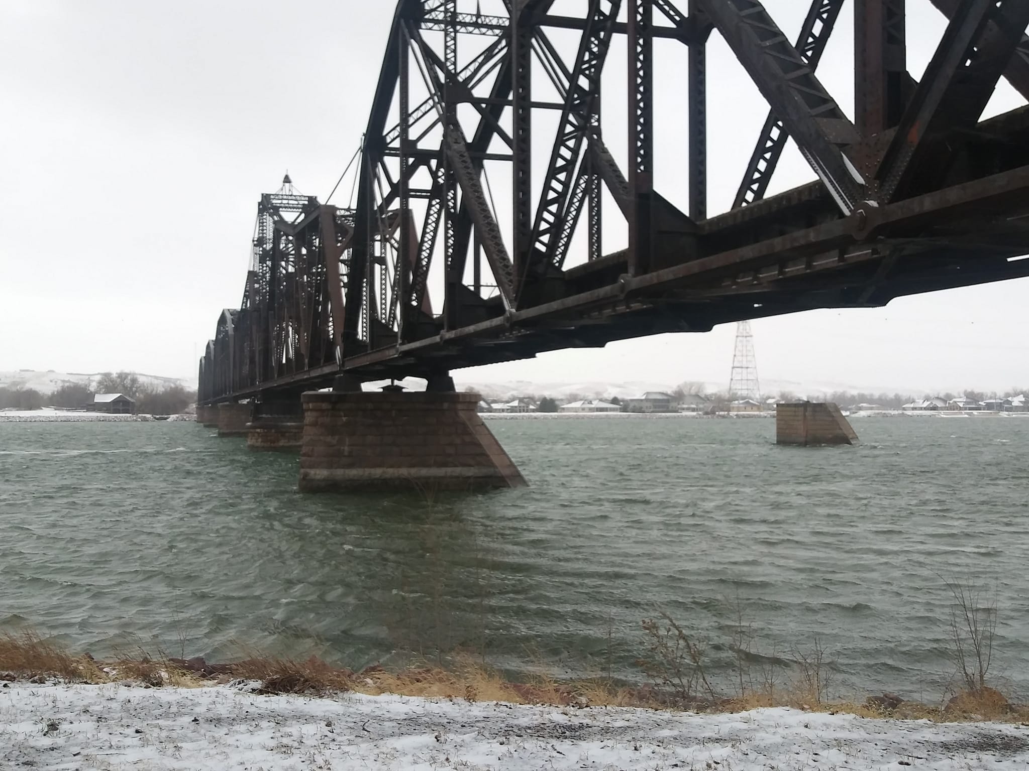 Police, Fire Officials Work To Bring Person Off And Away From Railroad Trestle Over Missouri River