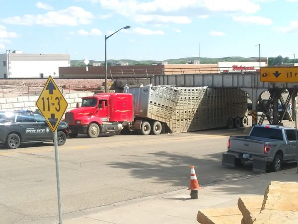 No Bull:  Fully Loaded Cattle Trailer Loses Battle With Pierre Railroad Viaduct