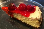 Cheesecake with Chocolate Graham Cracker Crust and Cherry Topping