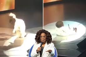 OPRAH: Tumbles On Stage