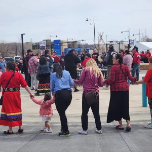 Community gathers to honour Red Dress Day