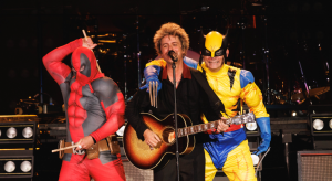 Green Day’s Tre Cool and Mike Dirnt surprise Billie Joe Armstrong by dressing up as Deadpool and Wolverine