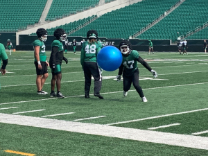 Delivering Hits and Giving Back: LB T.J. Brunson making an immediate impact with Roughriders