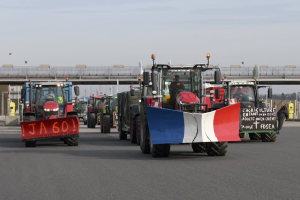 France’s protesting farmers encircle Paris with tractor barricades, vowing a ‘siege’ over grievances