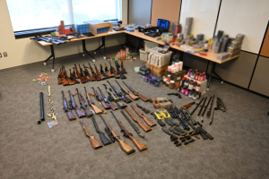 One charged with firearms trafficking after 60+ firearms and 10,000 rounds of ammunition seized