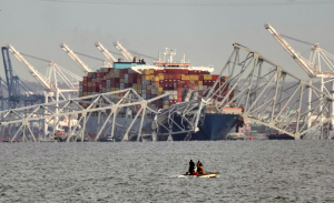 Cargo ship hits Baltimore’s Key Bridge, bringing it down. Rescuers are looking for people in water